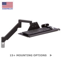 TRS7000AKP height adjustable keyboard arm in black shown in an isometric view with a 26" tray with palm rest and mouse trap in high position.